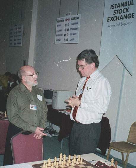 Stewart Reuben, left, is speaking to another arbiter